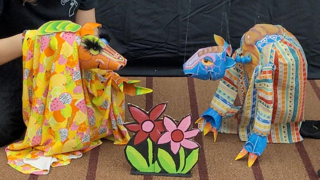 Photo of 2 armadillo puppets
